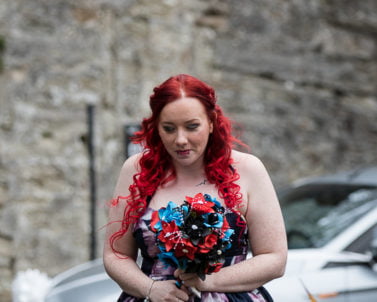 The Bride of the day walking to the ceremony with party dj Cornwall taking the photos.