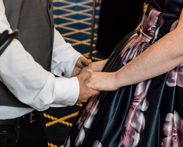 Holding hands at the ceremony with wedding Dj Cornwall.